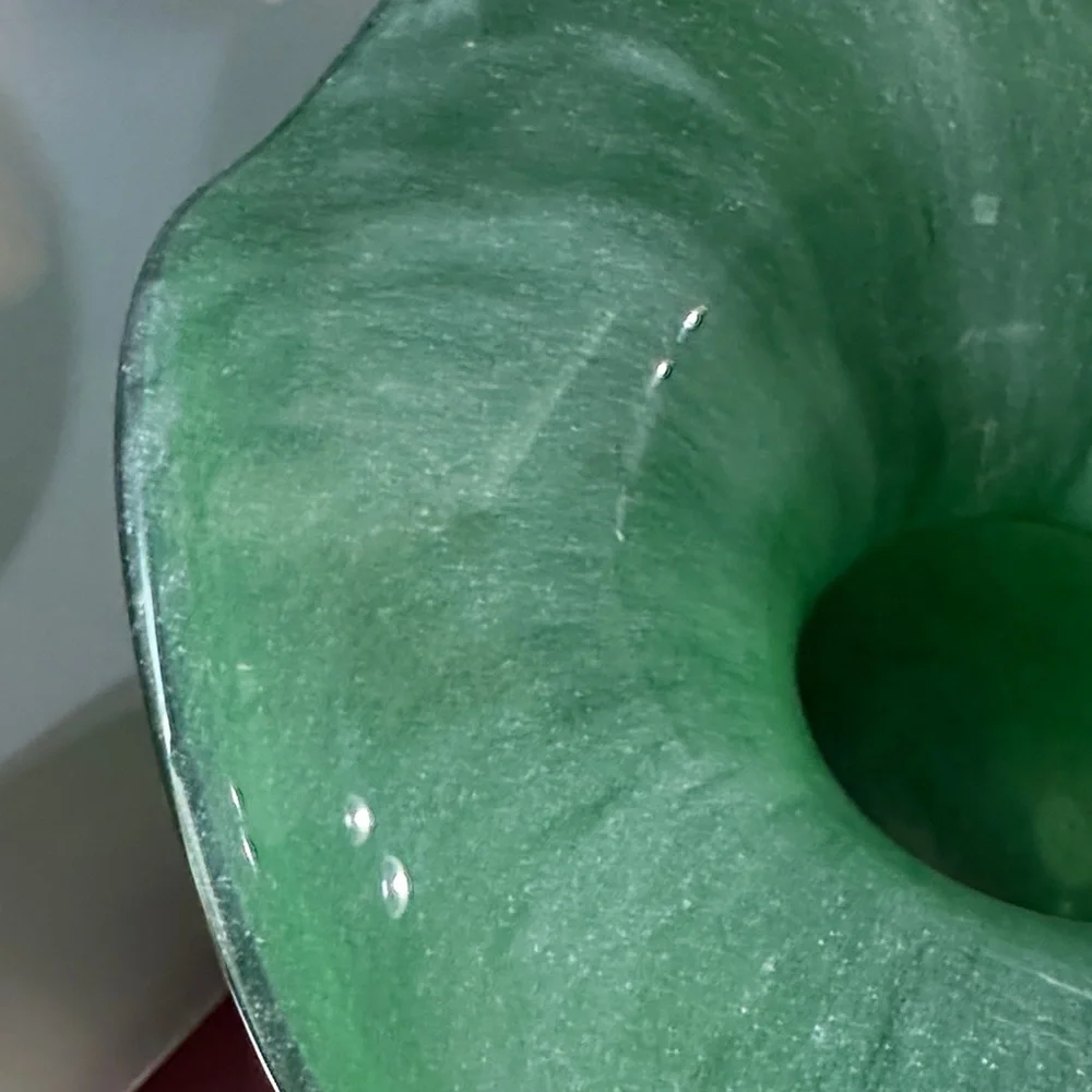 Elegant Hibiscus Fluted Vase in green glass.